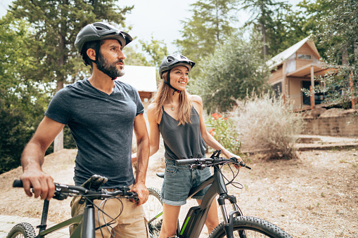 happiness couple with mountain ebike outdoors