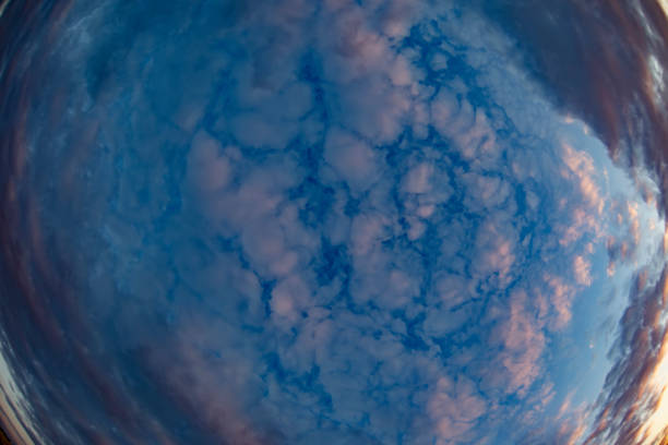 Banner beautiful thick blue clouds with pink veins. Mystical sky.