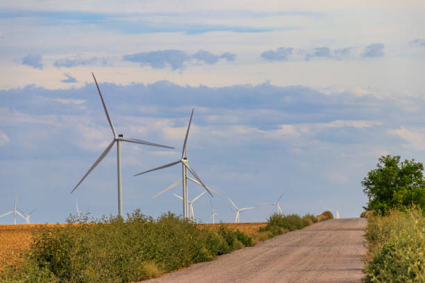 istock Wind turbines in a field. Renewable energy 1329888092