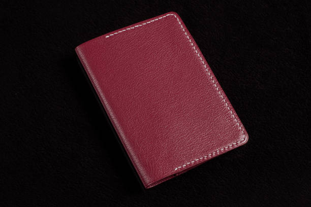 istock Leather wallet in brown on a black background. 1329888160