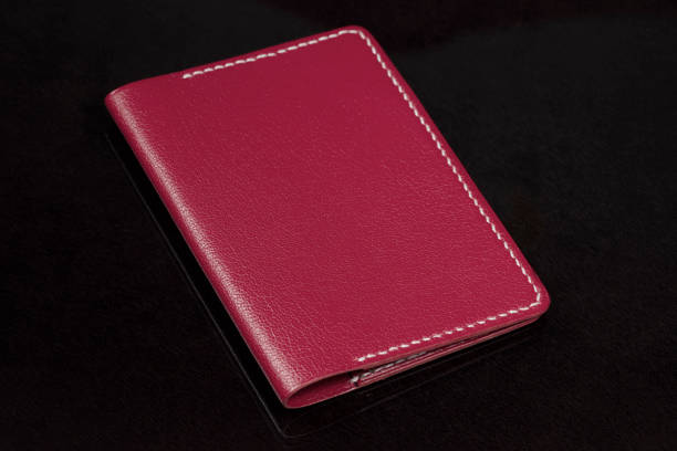 istock Leather wallet in red on a black background. 1329888313