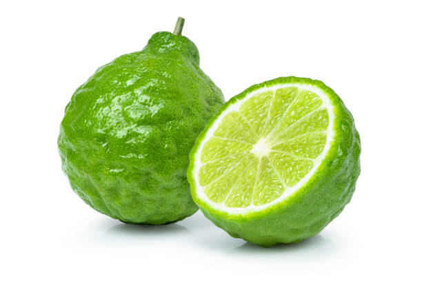 istock Bergamot fruit and cut in half sliced isolated on white 1329895904