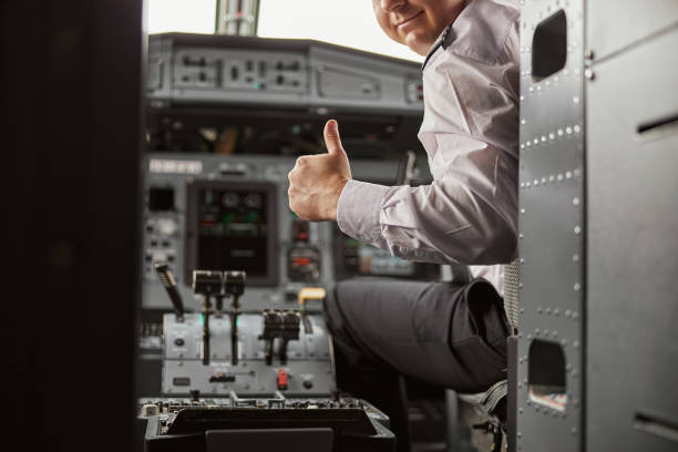 istock Pilot show thumb up gesture in cockpit of airplane 1329897285