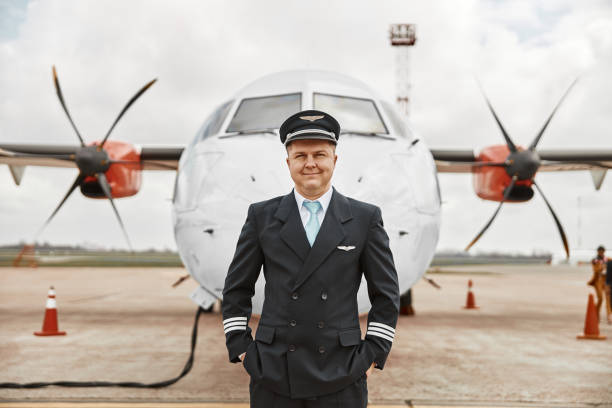 istock Pilot stand on runway on airplane jet background 1329897322