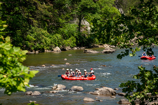 Unicoi County, Tennessee - May 25, 2015: On Memorial Day, a group of people raft down the Nolichucky River in northeast Tennessee.