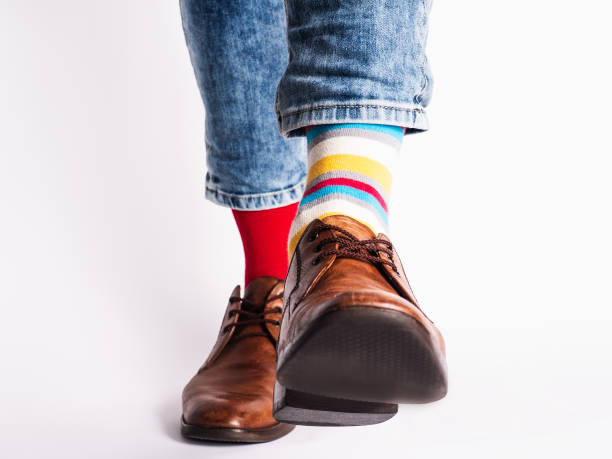 istock Men's legs, trendy shoes and bright socks 1329901372