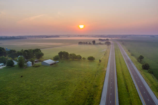 istock Magic summer morning mist over the field on countryside 1329901437