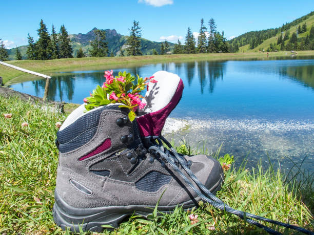 istock Mountain lake in Austrian Alps with hiking boot 1329903325