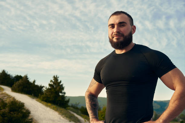 istock Young bearded man portrait outdoors in the mountains 1329905328