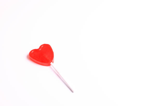 istock A heart shaped lollipop on white background with space to write 1329905343