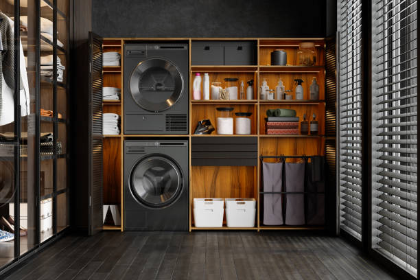 luxurious laundry room interior with washing machine, dryer, laundry basket and folded towels in the cabinet - lavar roupa imagens e fotografias de stock