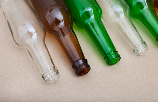 Empty glass bottles for recycling