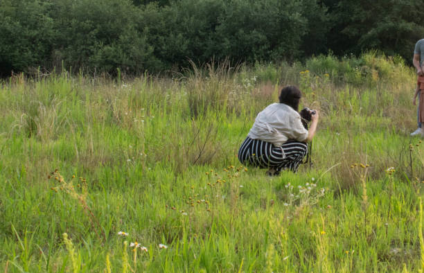 istock Pregnant Photographer in action 1329907805