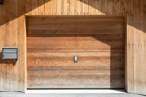 wooden garage door in wood house