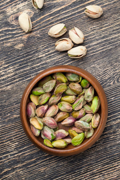 istock delicious natural dried and salted pistachio nuts 1329912281