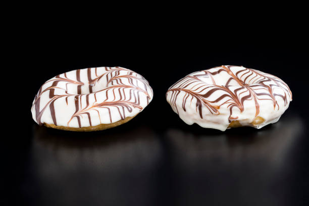 istock delicious doughnuts with chocolate covered filling, close up 1329912289