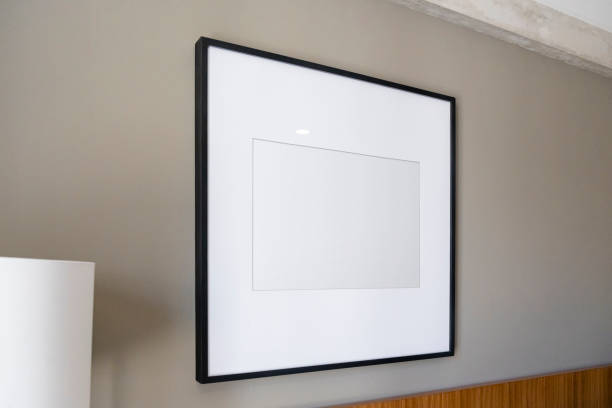 istock Modern house decoration, empty black square frame, poster, white canvas, mock up, on a gray wall,  bedroom, low angle view 1329916421
