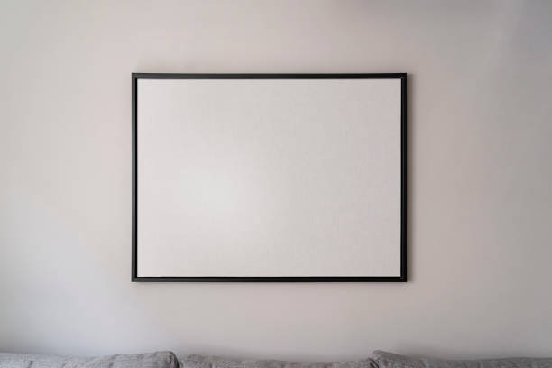 istock Interior decoration, empty black square frame, poster, white canvas mock up on a gray wall, living room template front view 1329916447
