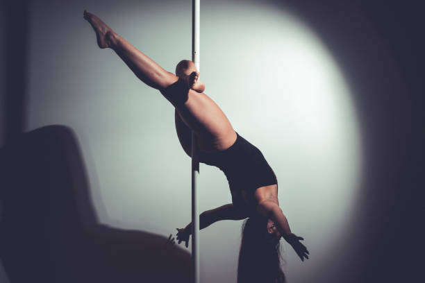 istock young asian woman doing pole dance at home 1329919684