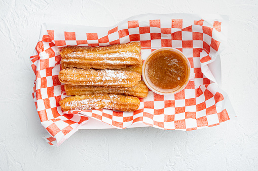 Churros take away set  in paper tray, on white background, top view flat lay