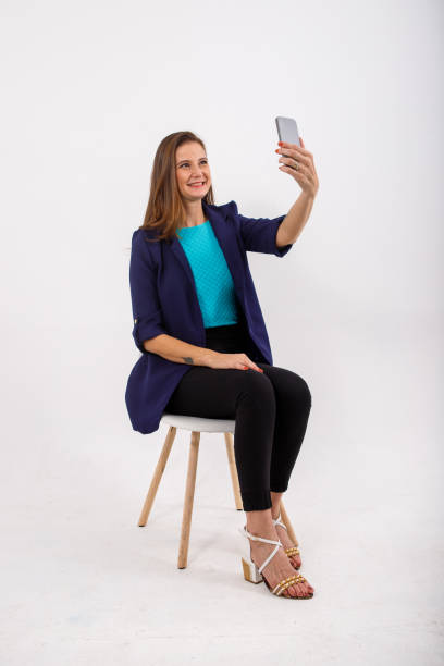 istock portrait of young woman using electronic device. 1329923179