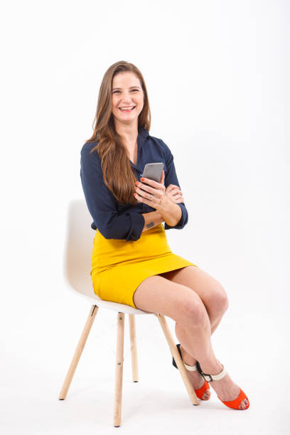 istock portrait of young woman using electronic device. 1329923224
