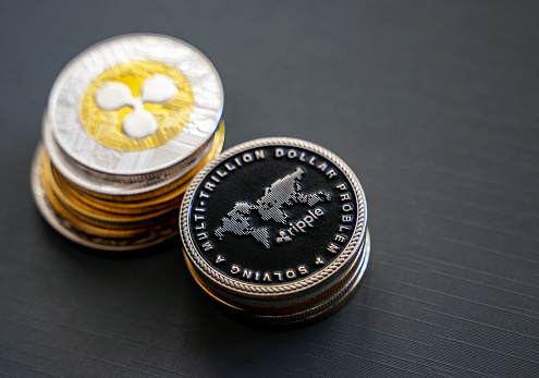 Antalya, Turkey - July 20, 2021: Close up shot of gold Ripple coins cryptocurrency, No people, Studio shot