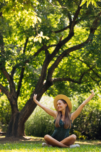 istock Woman sitting at the park 1329925165