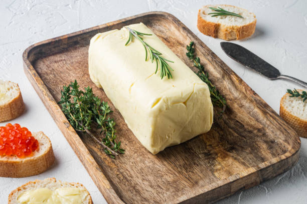 istock Block of fresh butter, on white background 1329925454