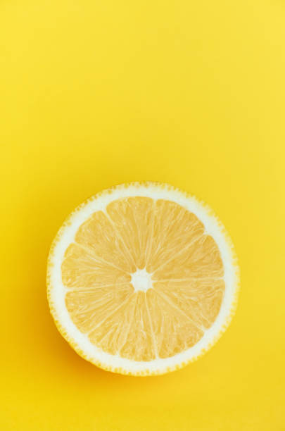 istock lemon in a cut on a yellow background 1329926510