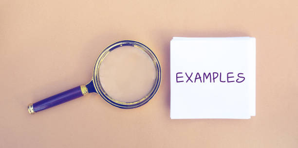istock Magnifying glass and a note with the word Examples. Example, instance, sample. Business, marketing and training concept. Flat lay 1329926714