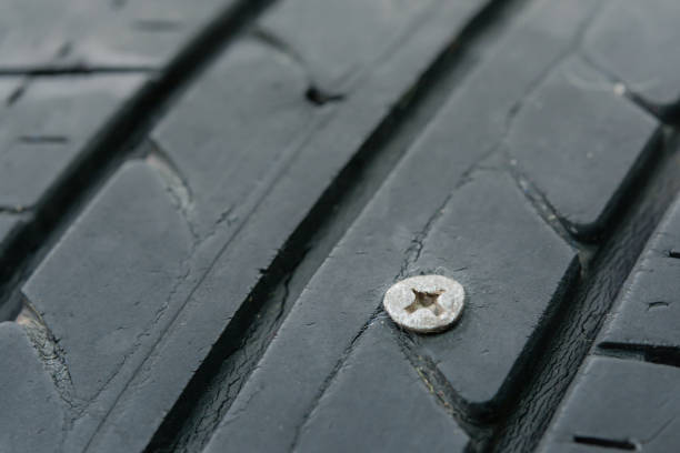 istock Metal screws nails embroidered in tires 1329927372
