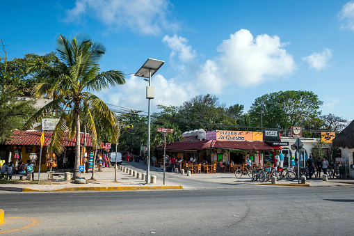Street scene at the intersection of Avenida Tulum and Calle Centauro Sur in Tulum, Mexico. (April 2021)