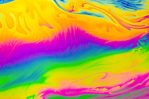 istock Rainbow colors. Psychedelic multi colored patterns background. Photo macro shot of soap bubbles 1329927695