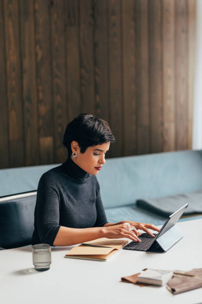 istock Beautiful Female Architect Working Hard on a Project 1329929693