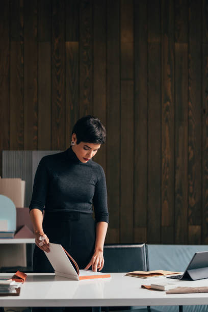 istock Successful Young Female Architect Working on a Project in her Studio 1329929694