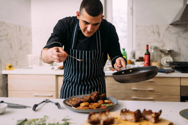 istock Young Professional Chef Preparing Tasty Meals in a Private Kitchen 1329930041