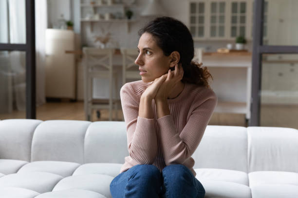 istock Thoughtful young hispanic woman feeling nervous at home. 1329930126