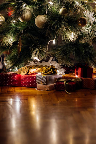 istock Merry Christmas: Close up Shot of Christmas Presents under a Decorated Tree 1329930838