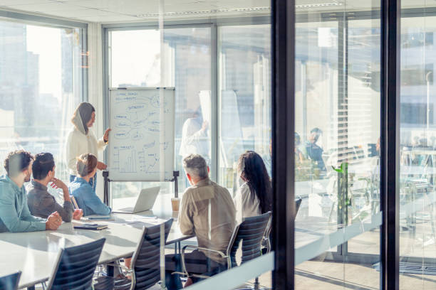 istock Business people watching a presentation on the whiteboard 1329935283