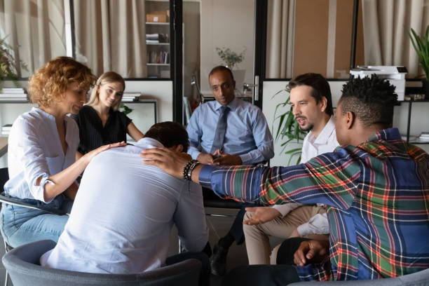 istock Rear view frustrated depressed man feeling unhappy during group session 1329936186