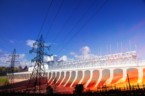 Photo Montage of a Large Hydro Electricity Dam with Electric Pylons and Power Lines