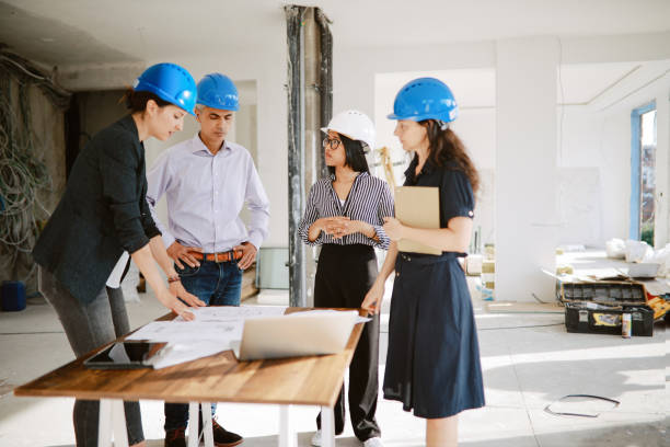 istock Architects and investors inspecting contruction site 1329943760