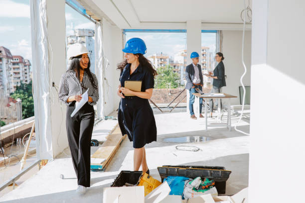 istock Architects and investors inspecting contruction site 1329943775
