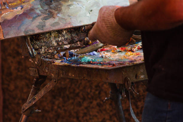 istock easel with oil paints artist's work colors 1329945041