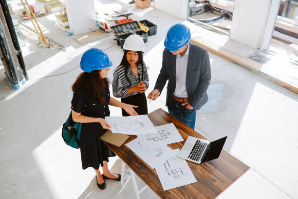 istock Overhead image of workers on the building construction site 1329945989