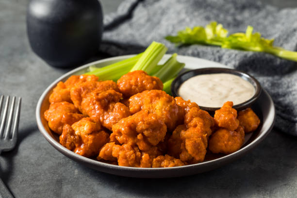 Homemade Fried Boneless Buffalo Chicken Wings Homemade Fried Boneless Buffalo Chicken Wings with Ranch Dressing salad dressing photos stock pictures, royalty-free photos & images