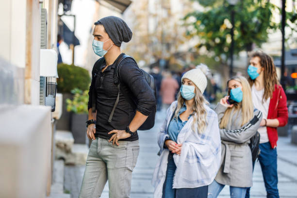 istock Queuing in ATM Machine During a Pandemic Time. 1329948514