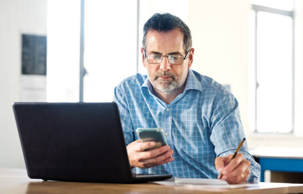 istock Senior business man working in office 1329949238