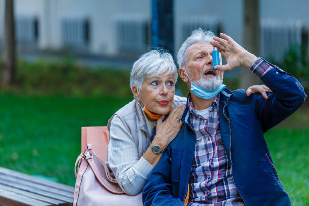 istock Ill Senior Man With Chronic Bronchitis is Using Inhaler. 1329950207